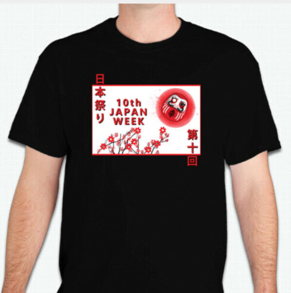 Black T-shirt with a red-and-white poster-like graphic: '10th JAPAN WEEK', cherry blossoms, and a red Daruma doll.